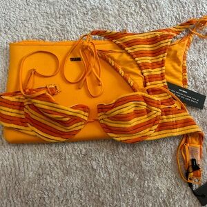 Never worn before, super cute, orange, triangl bathing suit